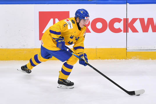 Emil Andrae of Sweden skates with the puck
