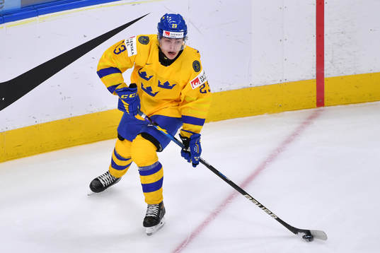 Jonathan Wikström of Sweden skates with the puck