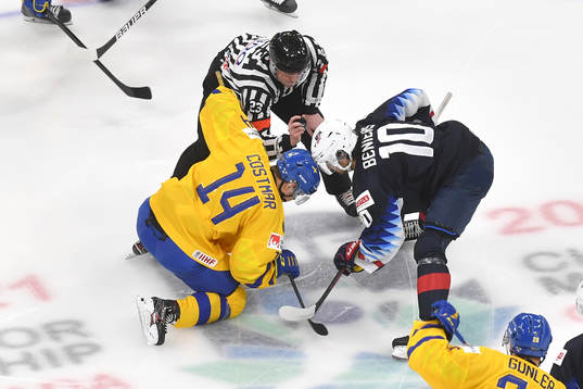 Arvid Costmar of Sweden and Matthew Beniers of USA face off