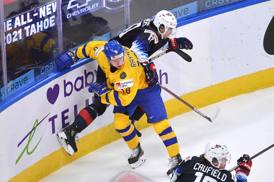Matthew Beniers of USA and Lucas Raymond of Sweden collide