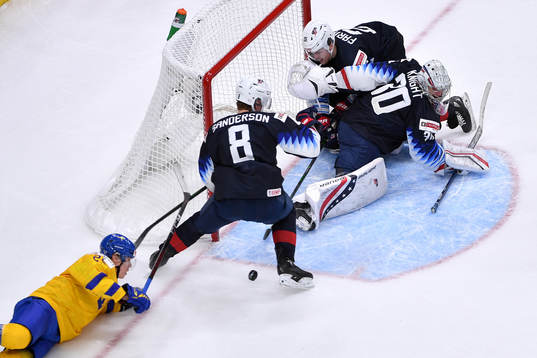 Elmer Söderblom of Sweden tries a wraparound while Spencer