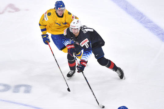 Oskar Olausson of Sweden pursues Matthew Beniers of USA