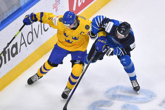 Philip Broberg of Sweden defends against Mikko Petman of