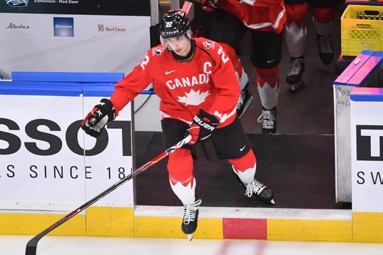 Dylan Cozens of Canada steps