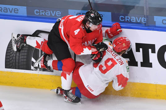 Bowen Byram of Canada knocks Vasili Podkolzin of Russia to