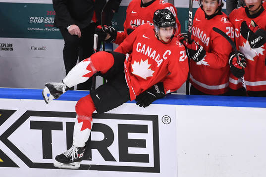 Dylan Cozens of Canada jumps the