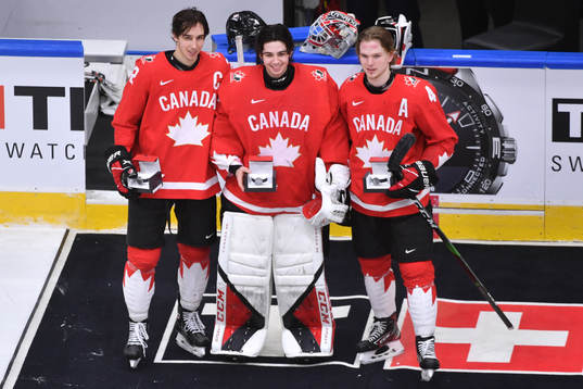 Dylan Cozens, Devon Levi and Bowen Byram of Canada pose