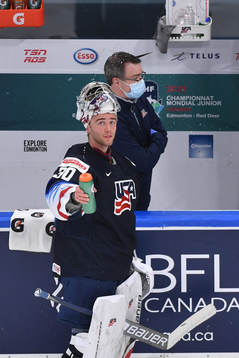 Spencer Knight of USA sprays water in the air