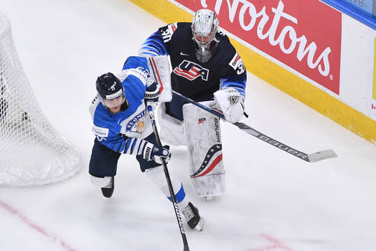 Mikko Petman of Finland collides with Spencer Knight of USA