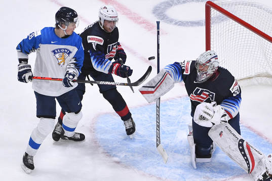 Spencer Knight of USA makes a blocker with Henri Nikkanen