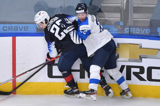 Roni Hirvonen of Finland collides with Ryan Johnson of USA during the 2021 IIHF World Junior Championship semifinal between USA and Finland on January 4, 2021 in Edmonton.
