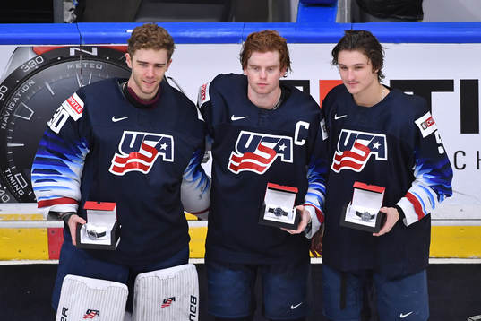 Spencer Knight, Cam York and Trevor Zegras of USA pose for