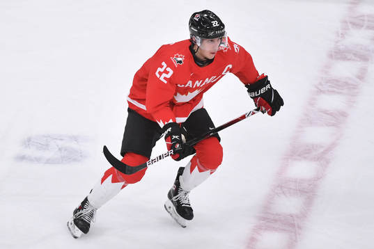 Dylan Cozens of Canada skates