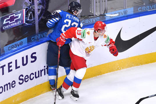 Vasili Podkolzin of Russia collides with Mikko Petman of