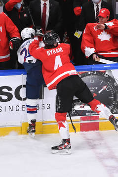 Bowen Byram of Canada knocks Bobby Brink of USA  into the