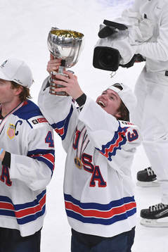 Cole Caufield of USA holds up the championship trophy after the 2021 IIHF World Junior Championship final between USA and Canada on January 5, 2021 in Edmonton.

