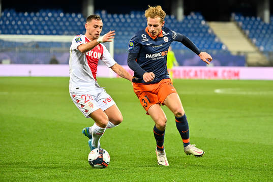  Fotboll, Franska Ligan, Montpellier - Monaco: Ruben AGUILAR of Monaco  and Nicolas COZZA of Montpellier  during the Ligue 1 match between Montpellier and Monaco at Stade de la Mosson on January 15, 2021 in Montpellier, France. (