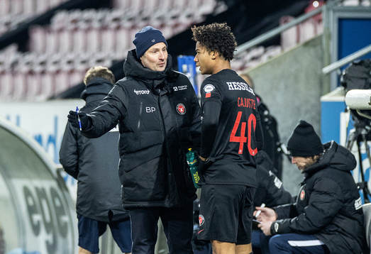  [DK=20210214: Brian Priske, træner FC Midtjylland og Jens-Lys Cajuste (40), FC Midtjylland]