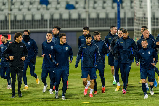 Players of the Kosovo national football team warm up