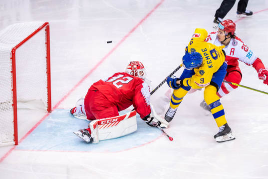 Adrian Kempe of Sweden and goalkeeper Sebastian Dahm and
