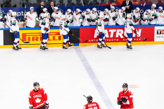 Mats Rosseli Olsen of Norway celebrates with team mates