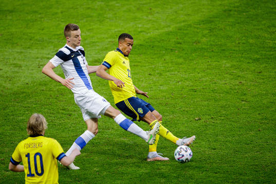 Tim Sparv of Finland and Robin Quaison of Sweden