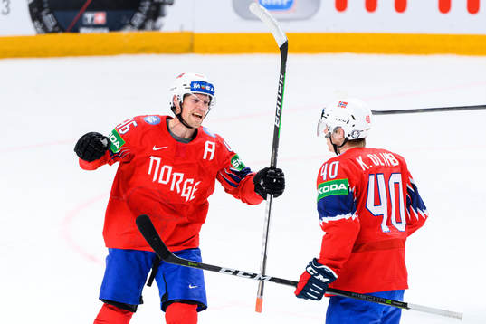 Mathis Olimb and Ken Andre Olimb of Norway celebrate the