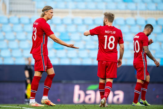 Erling Braut Haaland of Norway celebrates with teammate Fredrik Midtsjø after scoring 1-0 during the international friendly football match between Norway and Luxembourg on June 2, 2021 in Malaga. 

