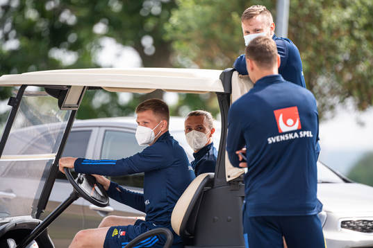 Mattias Johansson, Niklas Hult and Joakim Nilsson of the Swedish national football team's reserve squad talking to Viktor Claesson ahead of a training session