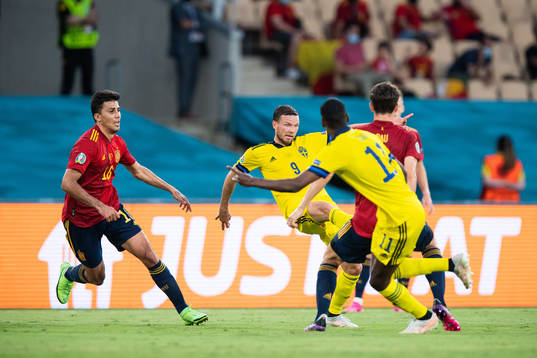 Rodri Rodri of Spain and Marcus Berg of Sweden