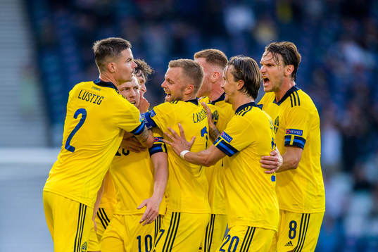 Mikael Lustig, Emil Forsberg, Sebastian Larsson and Kristoffer Olsson of Sweden celebrate after 1-1
