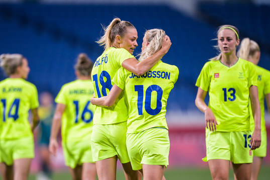 Fridolina Rolfö and Sofia Jakobsson of Sweden celebrate after 3-2