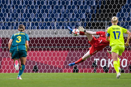 Hedvig Lindahl of Sweden saves a penalty from Sam Kerr of