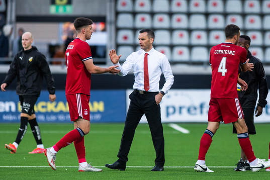 Declan Gallagher and Stephen Glass, head coach of Aberdeen, celebrate