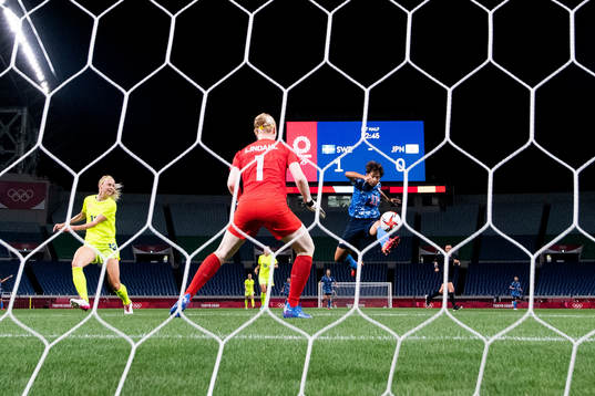 Mina Tanaka of Japan scores 1-1 in the women's football