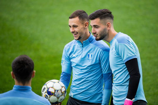 Veljko Birmancevic and goalkeeper Marko Johansson