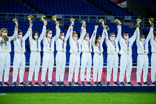 Team USA celebrate on the podium