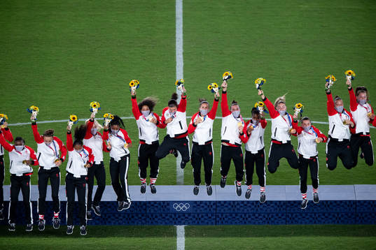 Players of Canada celebrates on the podium