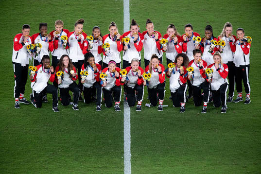 Players of Canada celebrates after the women’s football final