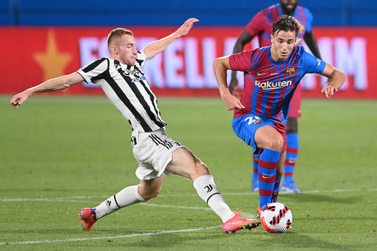 Dejan Kulusevski of Juventus and Nico González of Barcelona