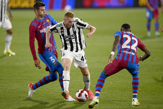 Gerard Piqué of Barcelona and Dejan Kulusevski of Juventus