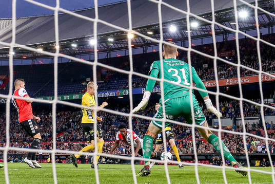 Luis Sinisterra off Feyenoord scores behind goalkeeper Tim