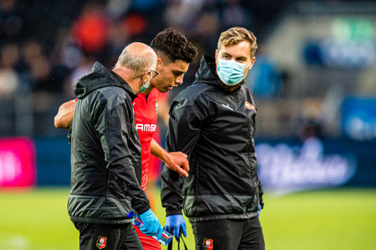 Matthis Abline of Rennes leaves the pitch with an injury