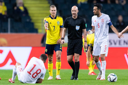 Jordi Alba of Spain, Viktor Claesson of Sweden and referee