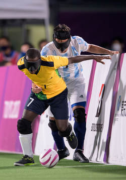 A handout photo made available by the Olympic Information Service of the International Olympic Committee show Jeferson Goncalves BRA is tackled boy Federico Accardi ARG in the Football 5-a-side Men's Gold Medal Match between Argentina and Brazil at the Aomi Urban Sports ParkTokyo 2020 Paralympic Games, Tokyo, Japan, Saturday 04 September 2021. 