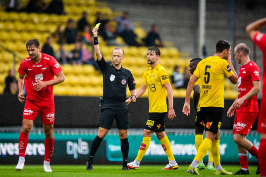 Fredrik Pallesen Knudsen of Brann is shown a yellow card