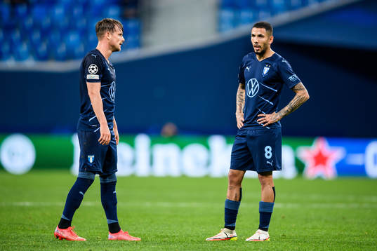 Eric Larsson and Sergio Pena of Malmö FF look dejected