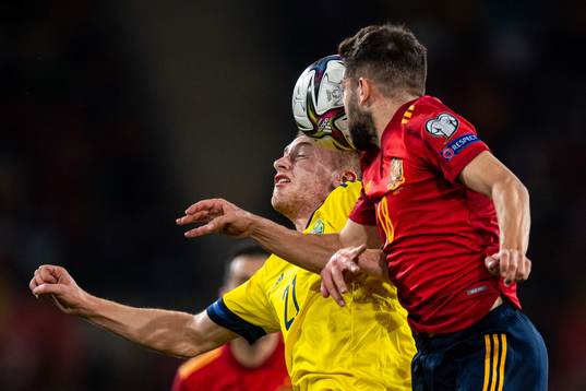Dejan Kulusevski of Sweden and Jordi Alba of Spain
