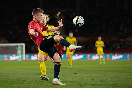 Dani Olmo of Spain and Emil Forsberg of Sweden