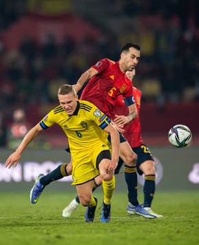 Ludwig Augustinsson of Sweden and Sergio Busquets of Spain